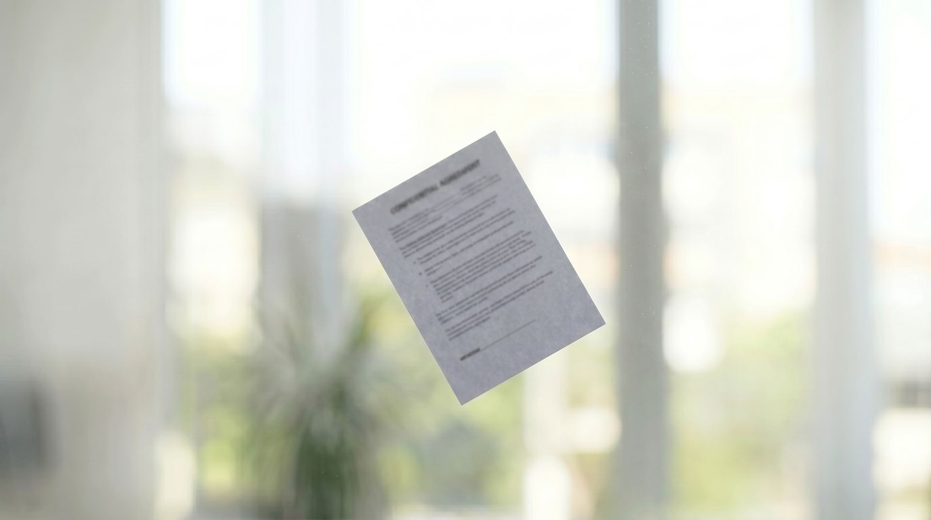 Confidential agreement document behind frosted glass, representing the HIPAA and 42 CFR Part 2 data privacy paradox